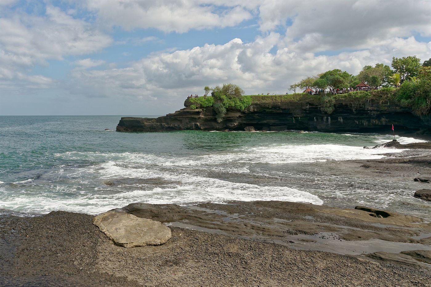 Tanah Lot sea temple on the Bali coast at sunset